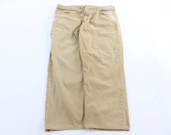 Pantalones Carhartt color canela con parche del logo, corte relajado