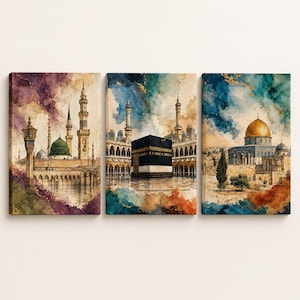 May include: A three-panel canvas wall art set featuring watercolour-style illustrations of Islamic landmarks. The left panel shows the Prophet's Mosque, the centre panel depicts the Kaaba, and the right panel displays the Dome of the Rock with gold accents.