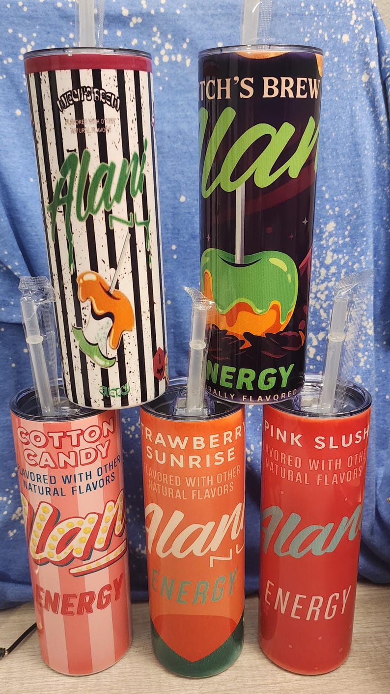 May include: A collection of insulated tumblers with straws, featuring various designs and flavors. The tumblers include "Witch's Brew," "Cotton Candy," "Rawberry Sunrise," and "Pink Slush" with colorful graphics and text.
