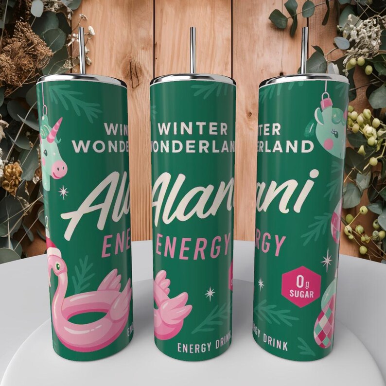 May include: Three green insulated tumblers with silver straws. Each tumbler features the text "Winter Wonderland" and "Alani Energy". One tumbler has a pink flamingo floatie, another has a unicorn, and the third has a Christmas ornament.