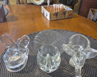 Three clear heavy glass trinket , holders or ringholders are small candle holders
