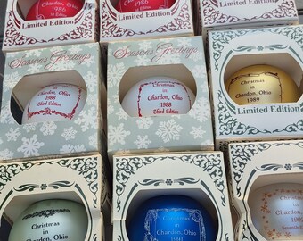 9 vintage colectable  Christmas ornaments for Chardon Ohio years 1986 to 1992 brand new in the original boxes.GLASS