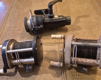 Three vintage fishing spinning reels the first is a Garcia Cardinal 752 also included are two Ocean City fishing reels