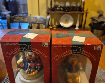 Two vintage year 2002 christmas treasures , handcrafted glass ornaments both are brand new in their original boxes