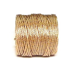 May include: A spool of beige embroidery floss.