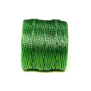 May include: A spool of green embroidery floss.