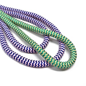 May include: Three cords of braided rope in pink and blue, green and beige, and beige and green.
