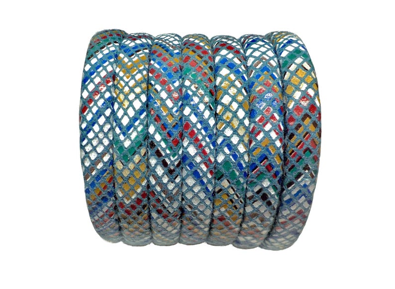 May include: A roll of blue leather cord with a white and multi-colored diamond pattern. The cord is approximately 1/2 inch wide.