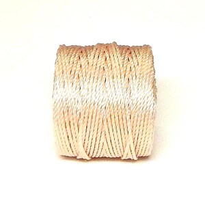 May include: A spool of cream-colored embroidery floss.