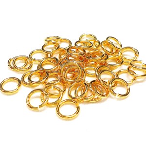 24K Gold Plated High Quality Brass Jump Rings 6.5mm x 4.5mm x 1mm, 18 Gauge, Non Tarnish - 10 pieces