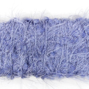 May include: A rectangular skein of blue yarn with a fluffy, textured appearance. The yarn has a soft, fuzzy texture with strands of silver thread woven throughout, creating a shimmering effect. Ideal for knitting and crochet projects.