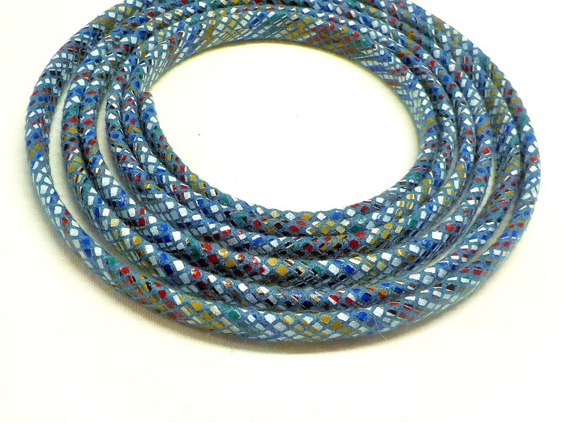 May include: A close-up of a blue cord with a multi-colored diamond pattern. The cord is coiled into a circle.
