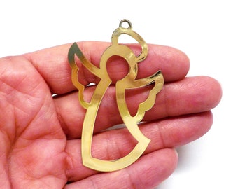 May include: Gold metal angel ornament with a halo and wings. The angel is cut out of the metal, creating a delicate and intricate design.