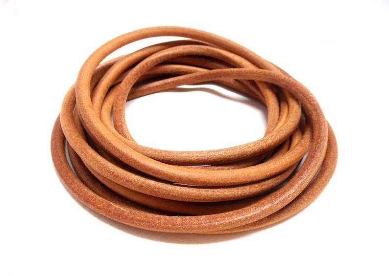 May include: A coil of brown leather cord, perfect for crafting projects.