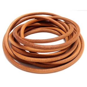 May include: A coil of brown leather cord, perfect for crafting projects.