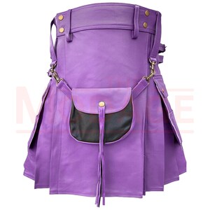 May include: A purple leather kilt with a black leather pocket and a gold buckle. The kilt has a fringe detail on the pocket.