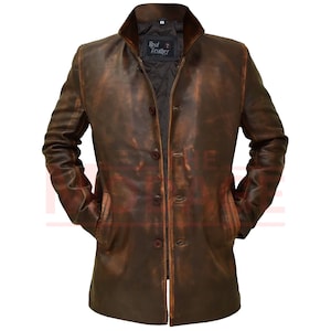 May include: A brown leather jacket with a distressed look. The jacket has a collar, a button-up front, and two pockets. The label on the jacket reads "Real Leather".