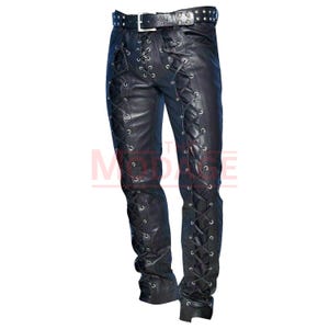 May include: Black leather pants with lace-up detailing on the sides. The pants have a belt with silver studs.