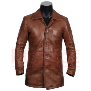 May include: A brown leather jacket with a button-up front and long sleeves.