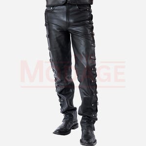 May include: Black leather trousers with multiple buckles and straps down the sides of the legs.