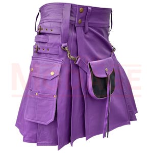 May include: Purple leather kilt with a large cargo pocket and a smaller pouch on the side. The kilt has multiple buckles and straps.