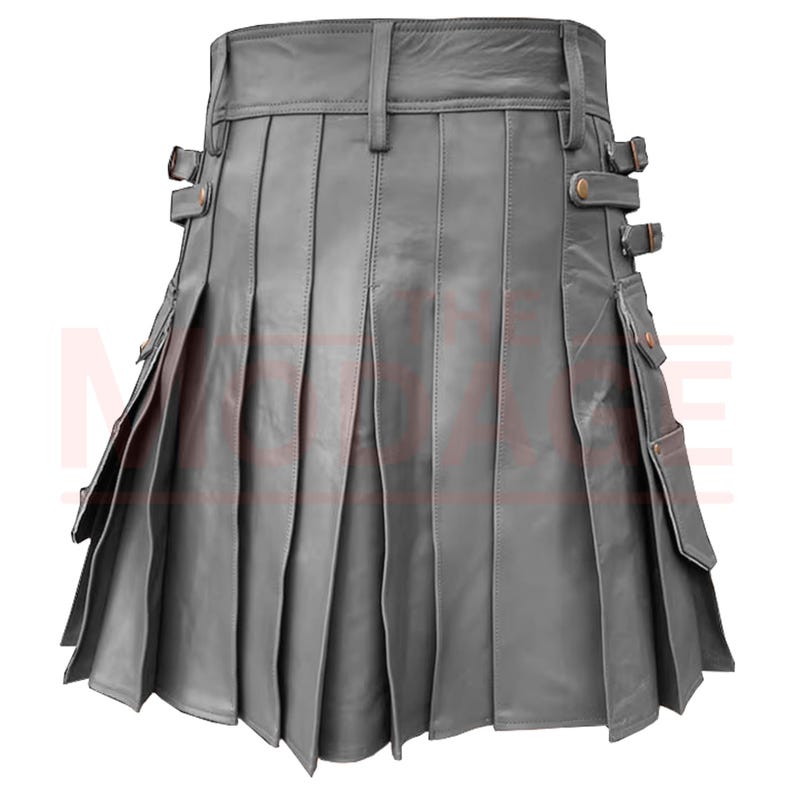 May include: A gray leather kilt with pleats and side pockets. The kilt has a buckle closure and adjustable straps.