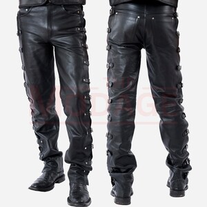 May include: Black leather trousers with multiple buckles and straps down the sides of the legs.