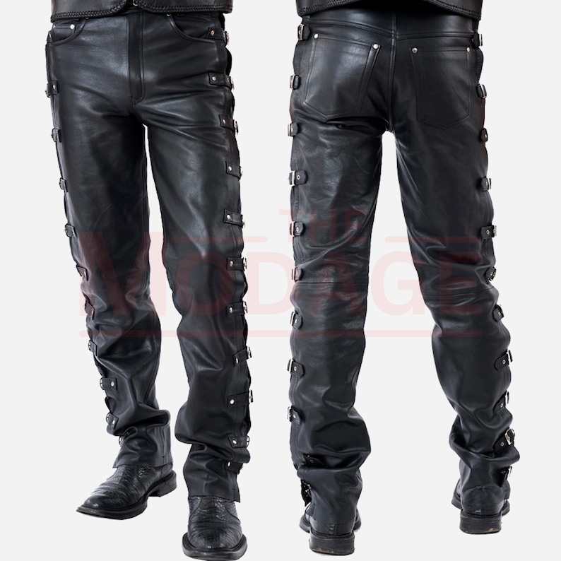 May include: Black leather trousers with multiple buckles and straps down the sides of the legs.