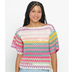 May include: A colorful crochet top with short sleeves and a striped pattern in shades of pink, green, yellow, and white.