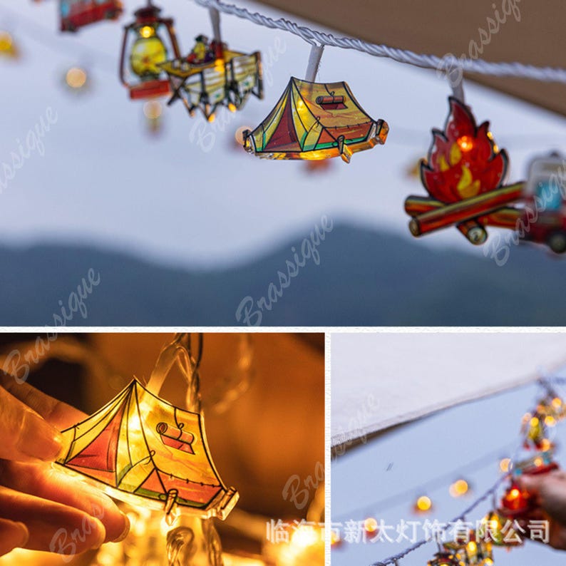 May include: String of camping-themed fairy lights. The lights feature miniature cutouts of tents, campfires, and lanterns. The lights are strung on a white cord and emit a warm, inviting glow, perfect for adding a touch of whimsy to any space.