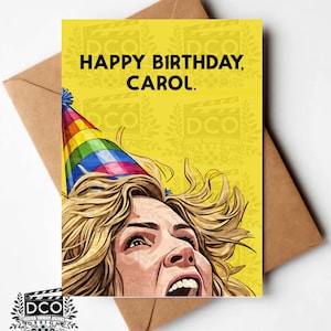 May include: A birthday card with the text "HAPPY BIRTHDAY, CAROL." features a cartoon illustration of a woman wearing a party hat. The card is yellow with a brown envelope.