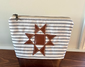Neceser con cremallera de pie hecho a mano: neceser de viaje acolchado de cuero con forma de estrella.
