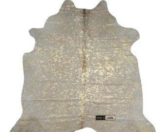Goud metallic koeienhuid vloerkleed – echte behaarde koeienhuid – luxe goudkleurige acid wash huid