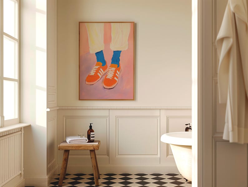 May include: A painting of a pair of orange sneakers with blue socks on a pink background.