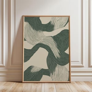 May include: Abstract art print featuring a design of overlapping, wavy lines in shades of green and cream. The print is framed in a natural wood frame.