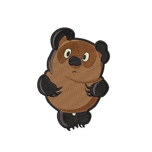 May include: Embroidered patch featuring a cartoon bear character with brown fur, black paws, and black ears. The bear has a surprised expression with large, oval eyes and a small, black nose. The patch is likely for clothing or accessories.