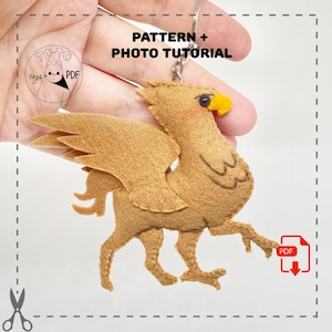 May include: A handmade felt griffin keychain in shades of brown, with a yellow beak and pink cheeks. The keychain includes a metal ring and the text "PATTERN + PHOTO TUTORIAL". A PDF icon is visible.