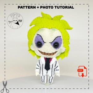 May include: A handmade felt doll of a character with green hair, a white and black striped suit, and a sinister grin. The doll has large black eyes and purple eye shadow. The text "PATTERN + PHOTO TUTORIAL" is at the top.