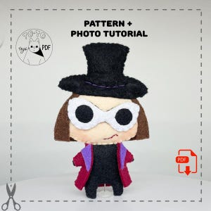 May include: A felt doll pattern and photo tutorial for making a Willy Wonka character. The doll is wearing a black top hat, purple and red jacket, and white sunglasses. The pattern is available as a PDF download.