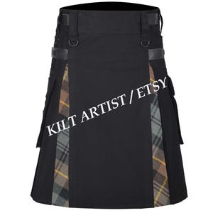 May include: Black kilt with tartan detailing. The kilt has black fabric with tartan panels in grey, brown, and yellow. It features leather straps and metal D-rings. The text "KILT ARTIST / ETSY" is printed across the front.