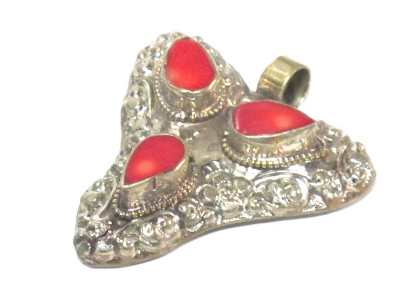 Ethnic Tibetan triangular arrowhead shape coral inlaid pendant from Nepal with lotus flower on reverse side 1 Pendant PM585A