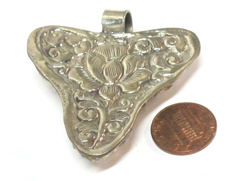 Ethnic Tibetan triangular arrowhead shape coral inlaid pendant from Nepal with lotus flower on reverse side 1 Pendant PM585A
