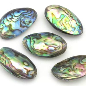 May include: Five oval-shaped abalone shells with iridescent colors of blue, green, and purple. The shells have a smooth, polished surface and a natural, organic appearance. These shells are ideal for jewelry making or decorative purposes.