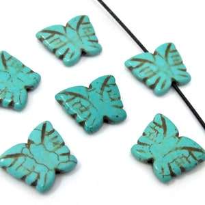 4 Beads- Blue turquoise color Howlite carved butterfly charm beads - GM401
