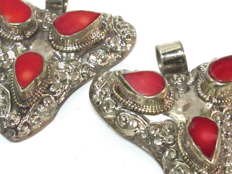 Ethnic Tibetan triangular arrowhead shape coral inlaid pendant from Nepal with lotus flower on reverse side 1 Pendant PM585A