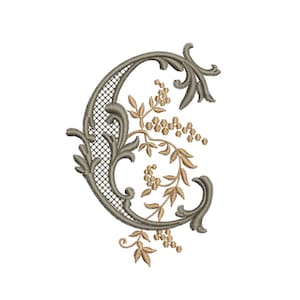 May include: Embroidered letter "C" in a decorative, ornate style. The letter is a muted gray-brown color with a lattice-like design in the center. Floral and leaf accents in gold and brown add detail to the design.