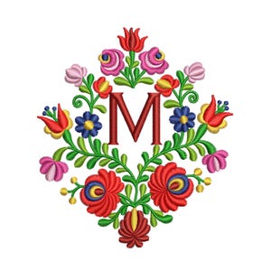 May include: Embroidered floral design with the letter "M" in the center. The flowers are red, pink, yellow, blue, and green.