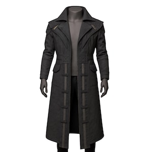 May include: A dark gray long coat with a notched collar, shoulder accents, and a double-breasted design. The coat features vertical accents and pockets, displayed on a mannequin. The coat is a long length, reaching the ankles.