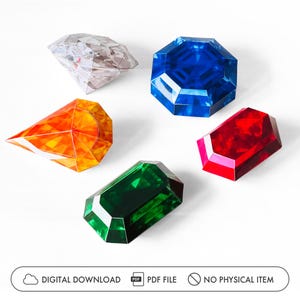 Könnte beinhalten: Eine Auswahl an farbenfrohen, facettierten Edelsteinformen in den Farben Klar, Blau, Orange, Grün und Rot. Die Edelsteine sind auf einer weißen Oberfläche angeordnet. Das Bild enthält den Text "DIGITALER DOWNLOAD PDF-DATEI KEIN PHYSISCHER ARTIKEL."