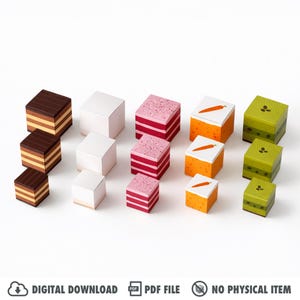 May include: A selection of cube-shaped paper boxes in various colours and designs. The boxes feature layered brown, white, pink with sprinkles, orange with a carrot, and green with leaf patterns. The image also includes the text "DIGITAL DOWNLOAD", "PDF FILE", and "NO PHYSICAL ITEM".